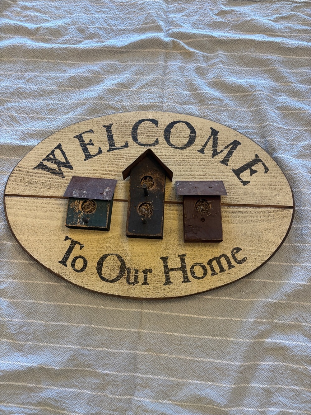 Vintage Welcome Sign with Blue, Black, and Brown Birdhouses